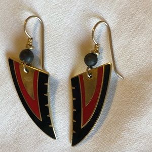 Tribal look gold tone metal and enamel pierced earrings.